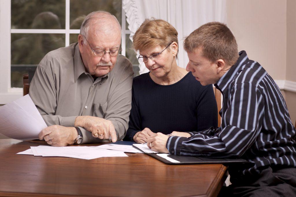 Parents and Adult Son Preparing a Will