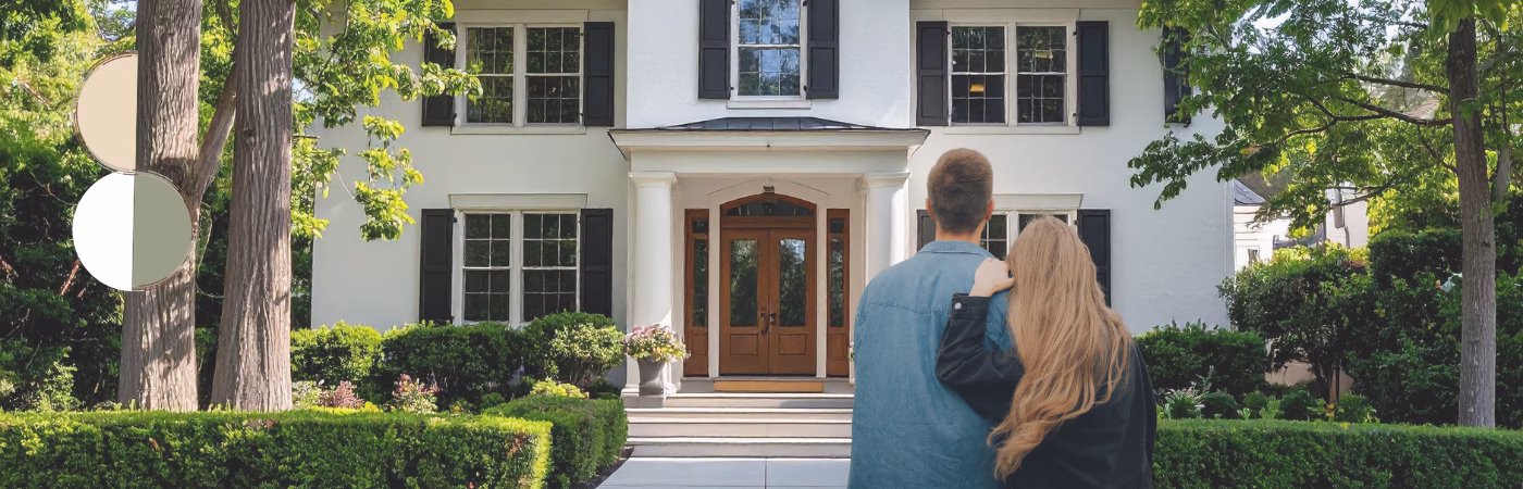 Couple staring back at a house